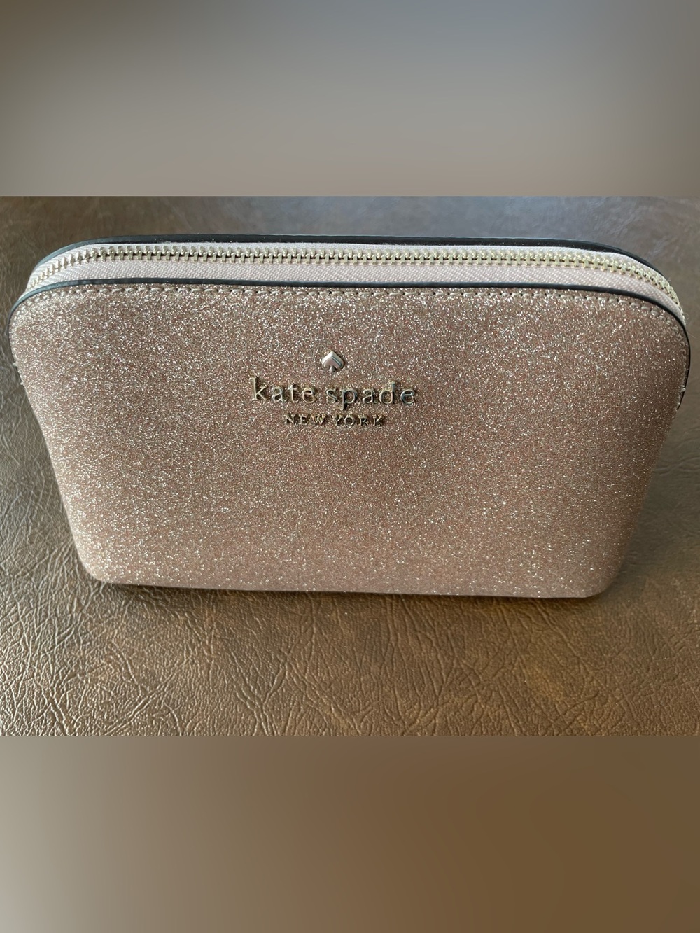 kate spade Rose Gold Glitter cosmetics bag.